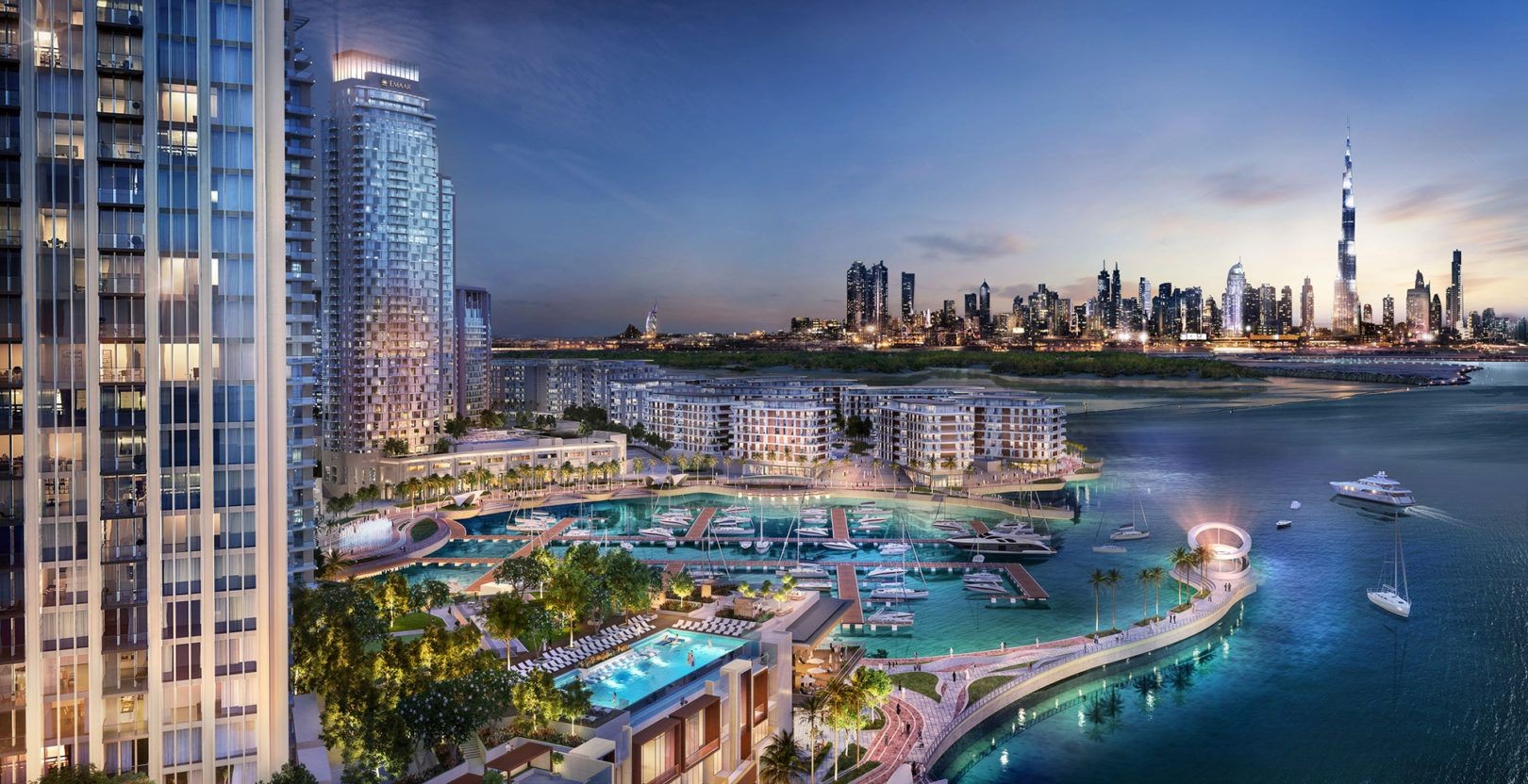 Aerial view of a luxurious waterfront cityscape with modern skyscrapers and marina at sunset.